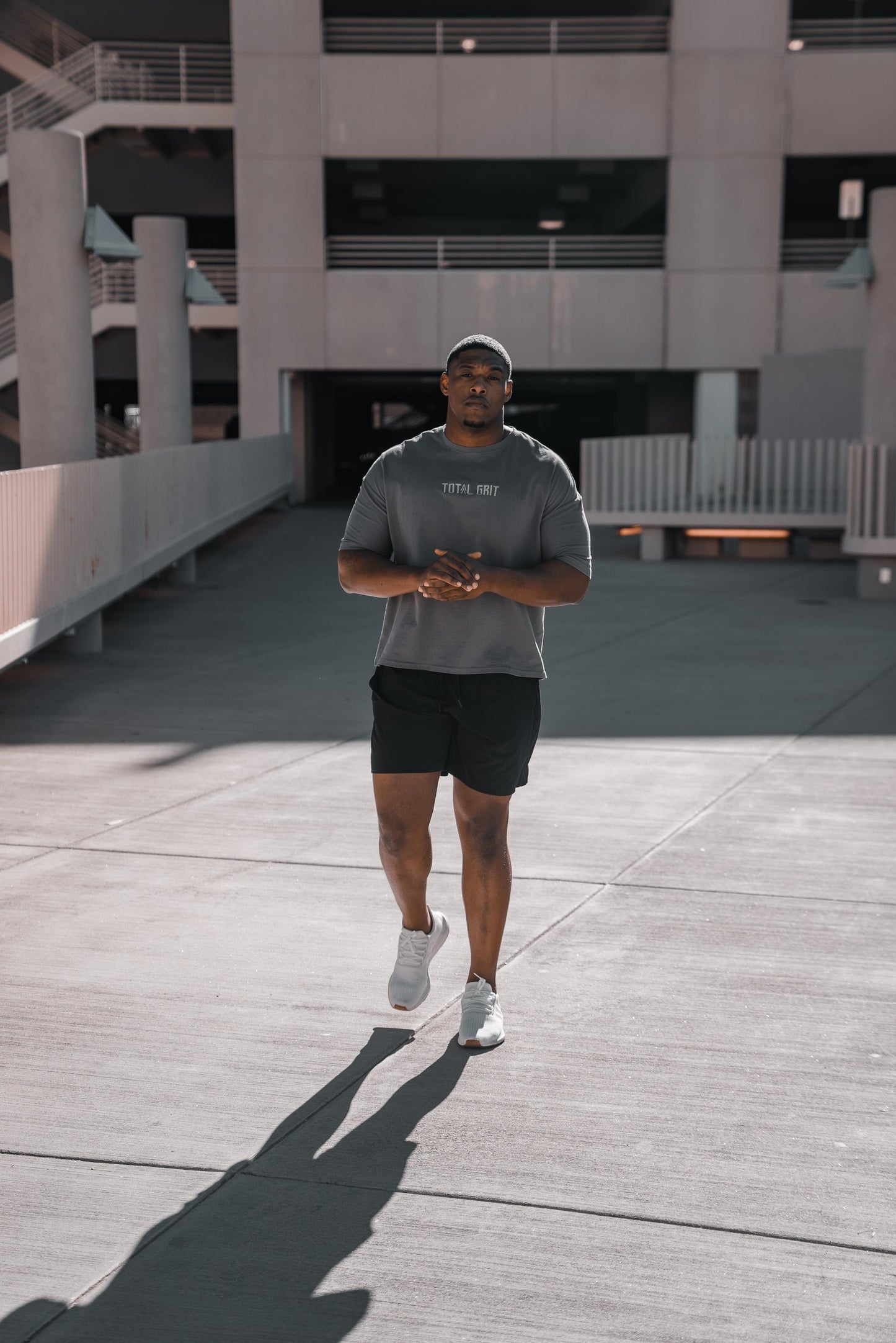 Model rocking the grey long sleeve in the street, perfect for an every day shirt, or to cover up a gnarly pump in the gym.