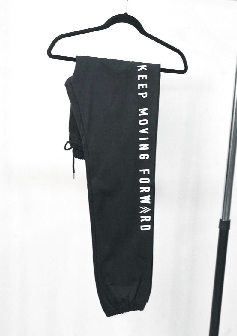 close up of the black KMF sweats showing off the slogan in clean lettering