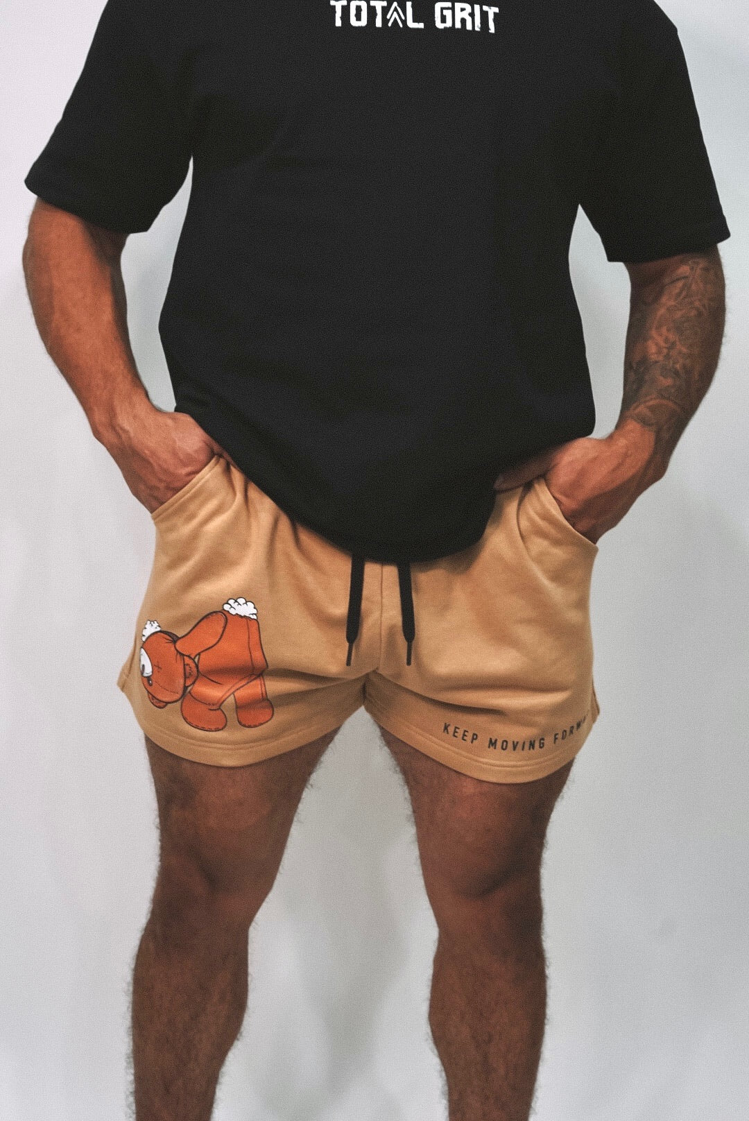 Front shot of the Teddy shorts, showing off that signature teddy design, and "KEEP MOVING FORWARD" slogan on the left leg.