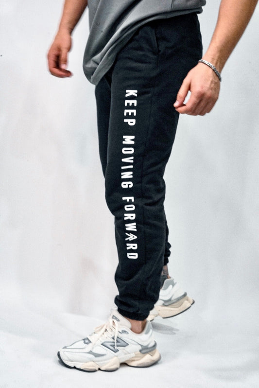 Black Keep Moving Forward sweats, showing off the slogan on the left leg.