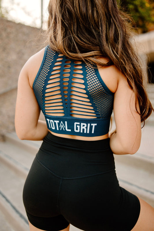 Navy Blue Total Grit sports bra, backside view showing off the breathable webbing design and Total Grit logo.
