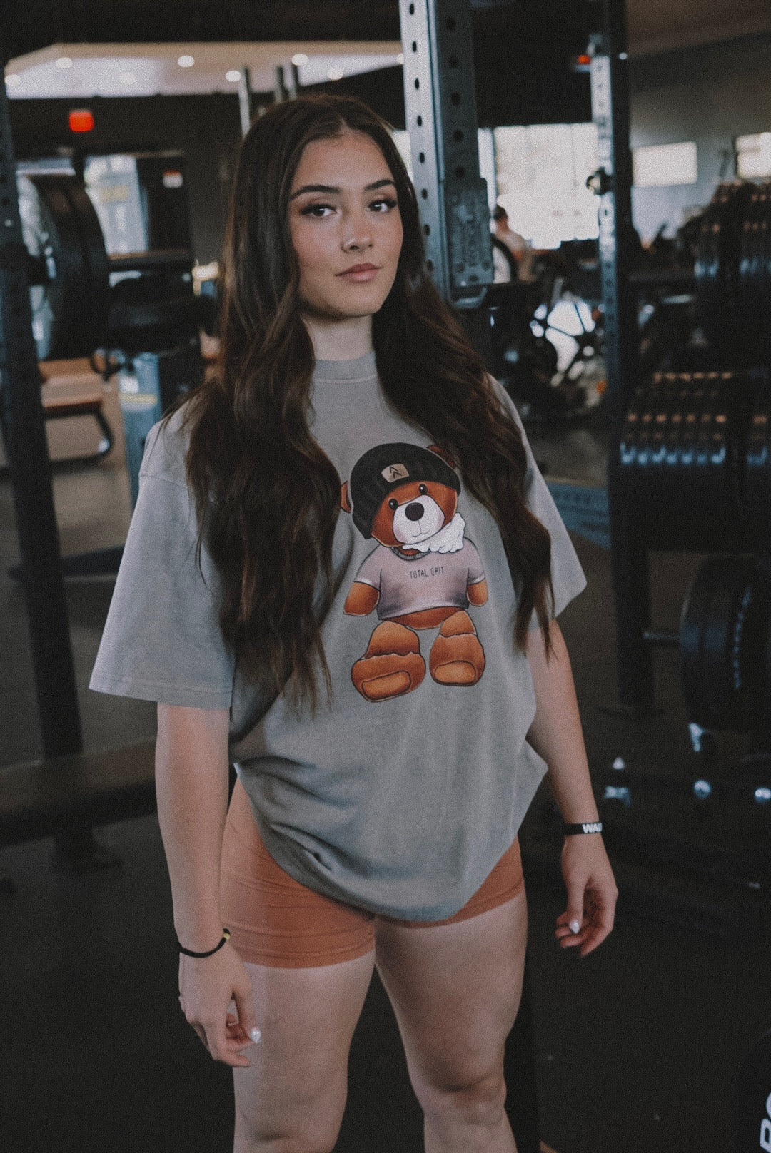 Beanier bear tee front shot showing of the vibrant colors of the teddy matching flawlessly with our rust colored biker shorts.