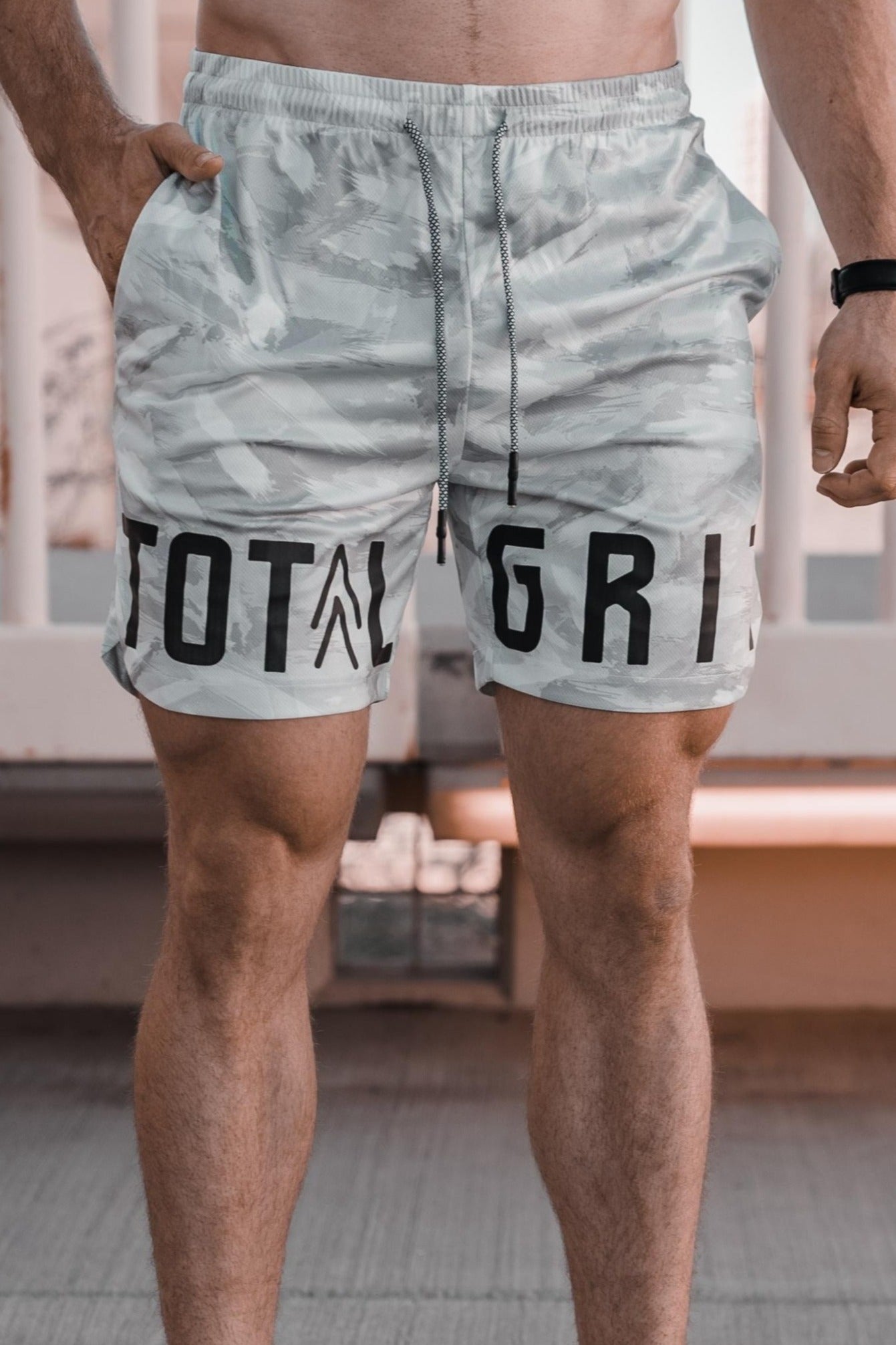 Front on shot of the white camo shorts showing off the Total Grit logo across the front.